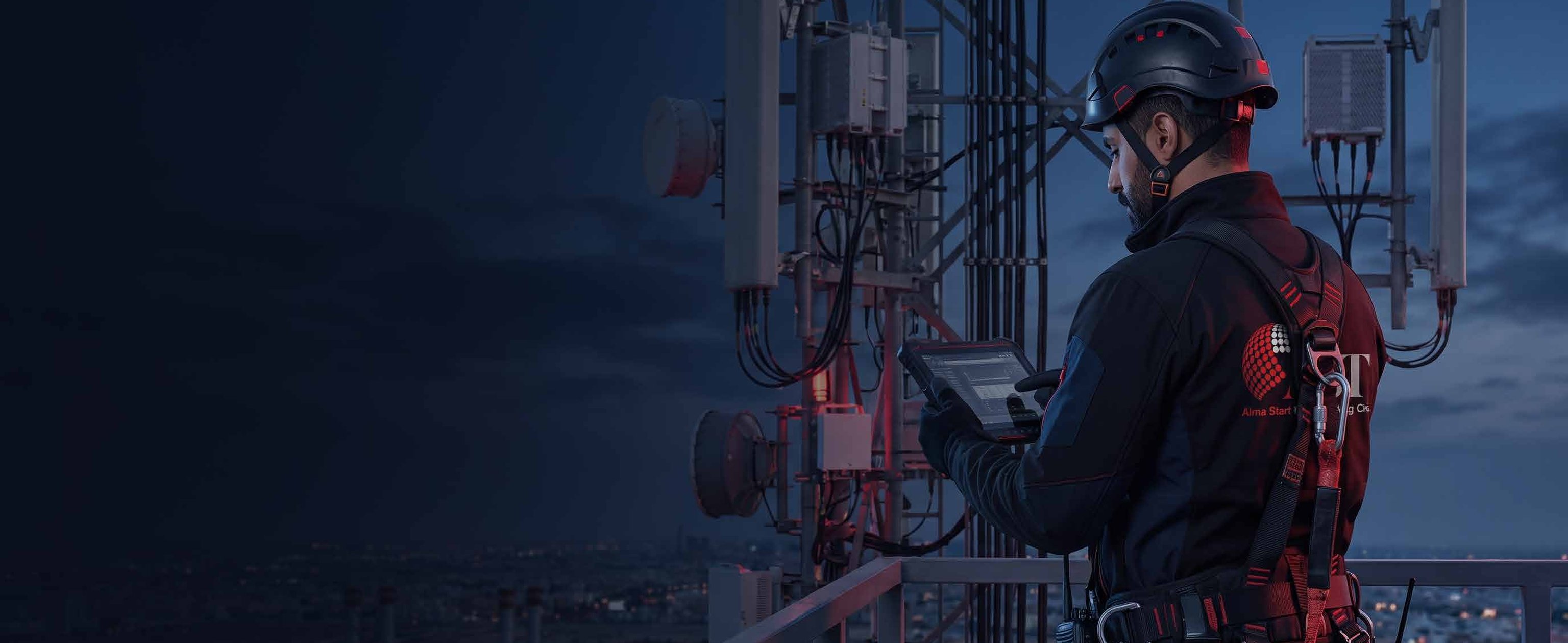 AST engineer working on a live telecom site