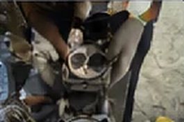 Technician servicing engine components
